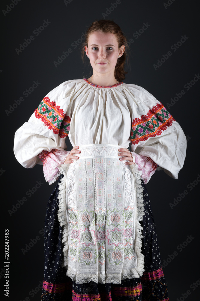 Young beautiful slovak woman in traditional costume 