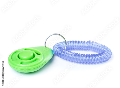 Foto Dog clicker - positive reinforcement training tool for dogs, isolated on white background