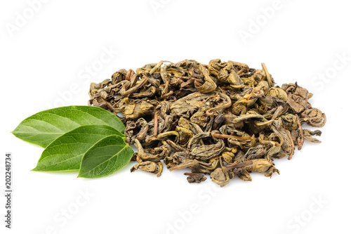 Pile of green tea with fresh leaves isolated.
