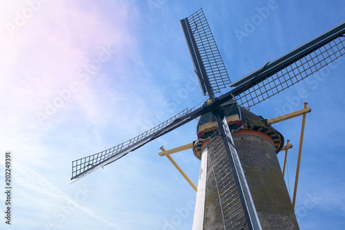 Old mill and blue sky in the netherlands. Free space for text. Card