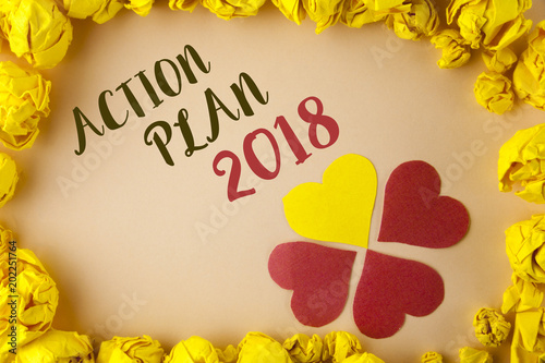 Conceptual hand writing showing Action Plan 2018. Business photo showcasing to do list in new year New year resolution goals Targets written on plain background within Paper Balls Hearts. © Artur