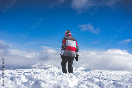 Young boy exploring the snowy landscape photo