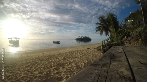 Time lapse - Landscape view of Taakoka islet at dusk in Muri Lagoon in Rarotonga, Cook Islands.  photo