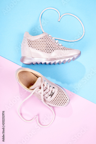 Pink Women's sneakers on a color background