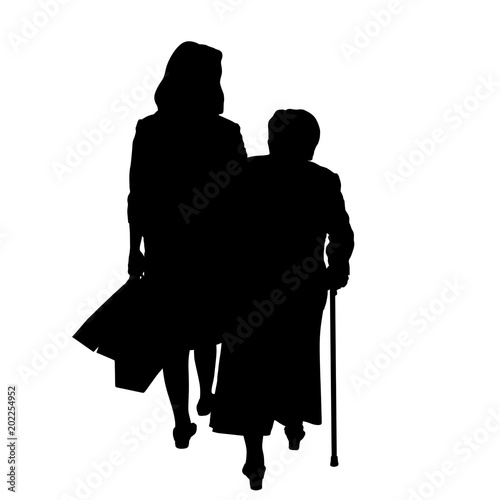 Adult daughter and elderly mother silhouette