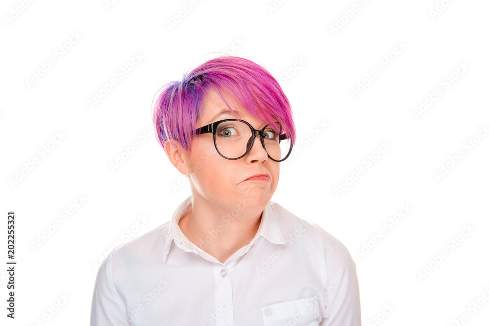 Suspicious girl in glasses looking at camera