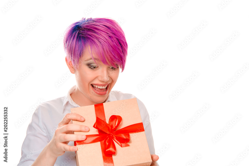 Happy woman opening holiday present