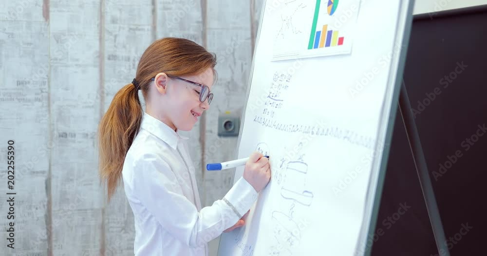 Female manager presents a new project plan to colleagues at a meeting, explaining ideas about a flip chart for colleagues in the office, a businessman giving a presentation. Business children Female manager presents a new project plan to colleagues at a meeting, explaining ideas about a flip chart for colleagues in the office, a businessman giving a presentation. Business children