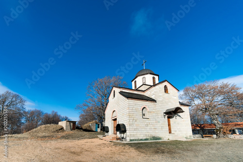Orthodox church in Macedonia on top of mountain against blue sky