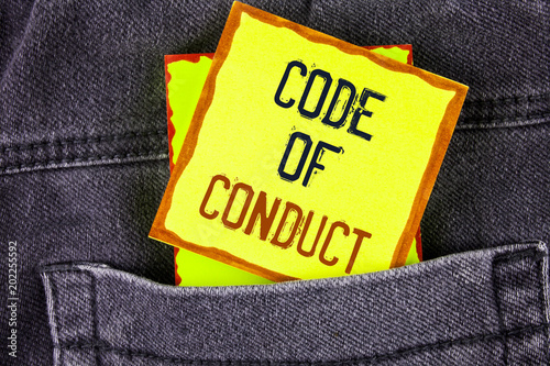 Text sign showing Code Of Conduct. Conceptual photo Follow principles and standards for business integrity written on Yellow Sticky Note Paper placed on the Jeans background.