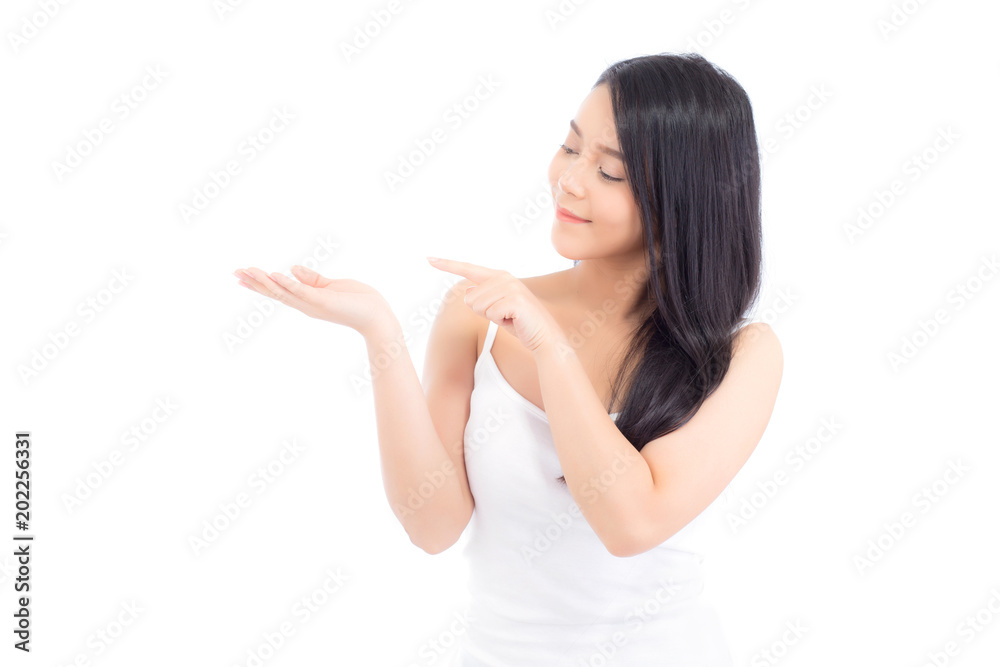 Asian beautiful young woman showing with healthy clean skin presenting something empty copy space on the hand isolated on white background, beauty concept. Asian beautiful young woman showing with healthy clean skin presenting something empty copy space on the hand isolated on white background, beauty concept.