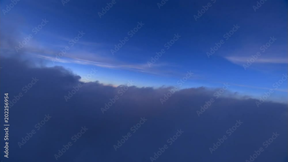 Tilting flight through clouds at dawn Tilting flight through clouds at dawn