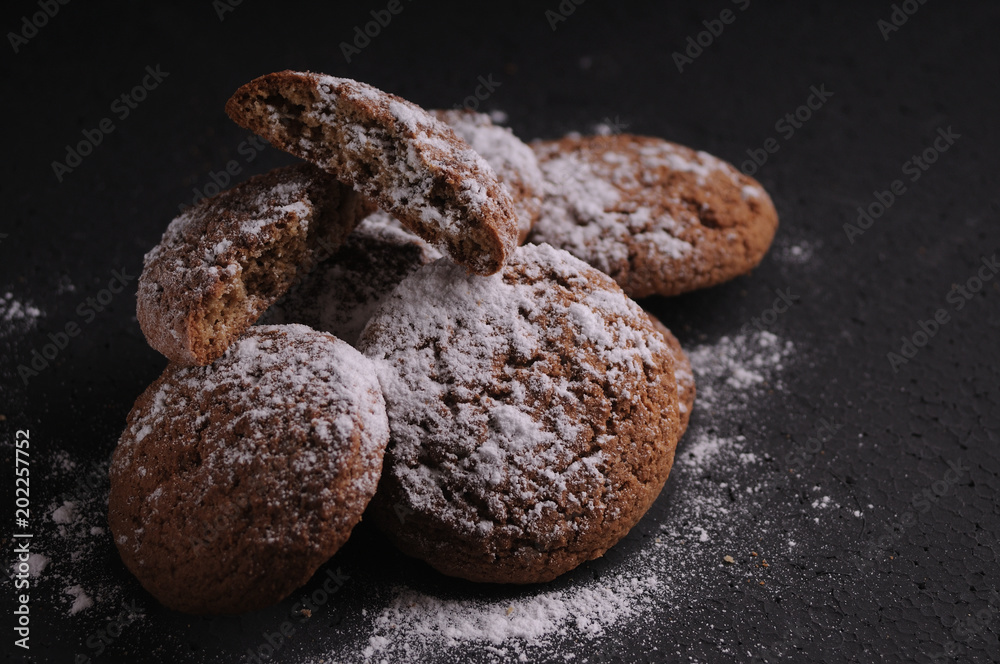 oatmeal cookies on a black table in castor sugar