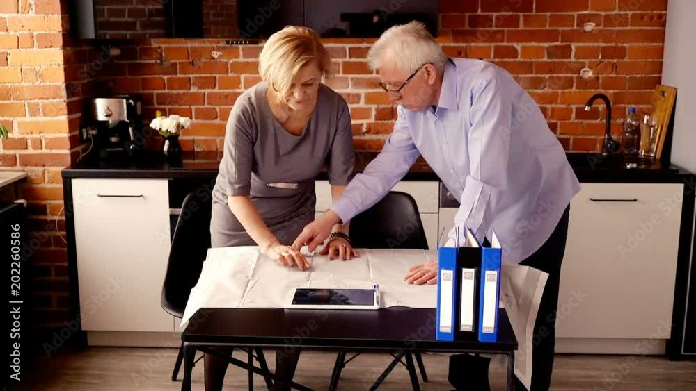 senior couple talking about projekt of their home
senior couple talking about projekt of their home