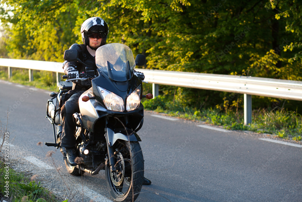 rider on a motorcycle - summer road trip on a motorbike