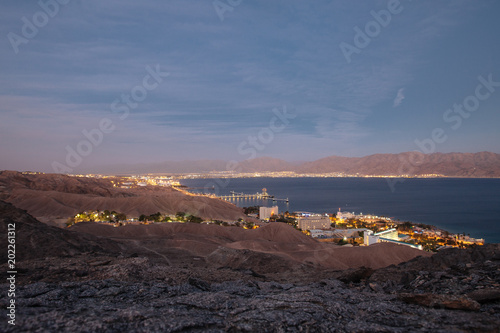 Vew to Eilat city in the desert in the Israil in the evening with blue sky and city lights