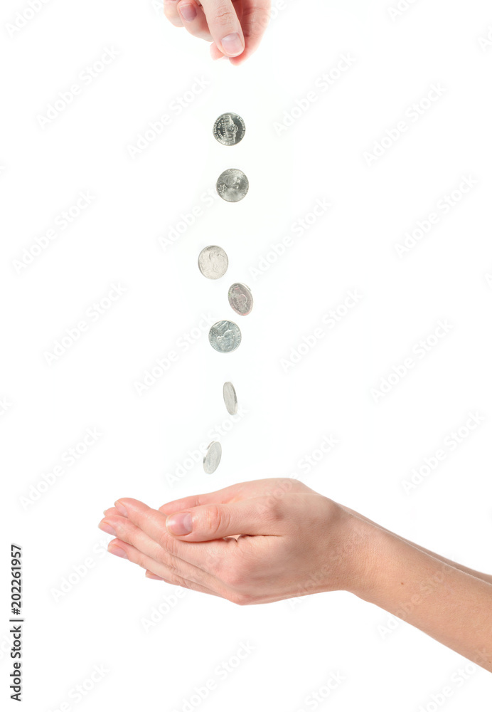 Female hands and falling coins on white background Female hands and falling coins on white background