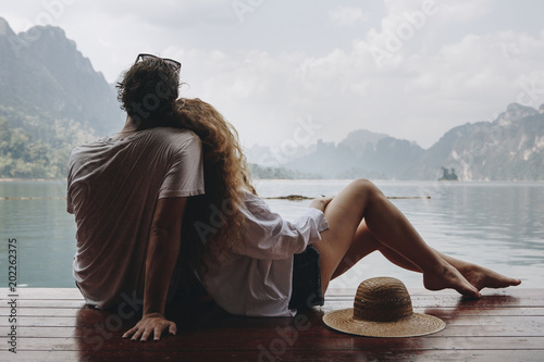Romantic couple contemplating mountain view