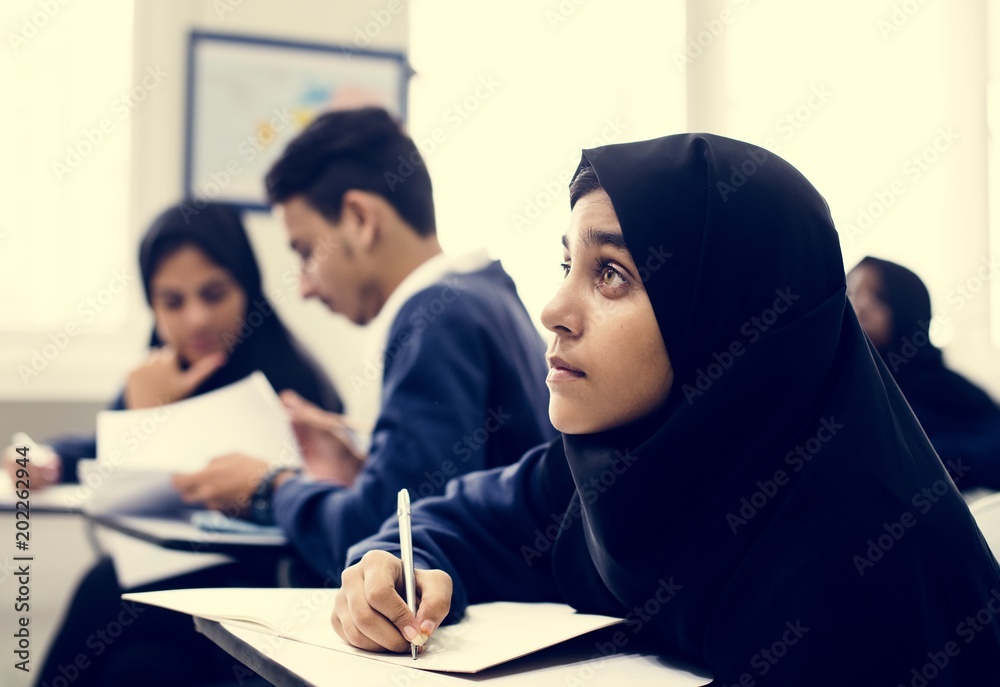 Diverse Muslim children studying in classroom Diverse Muslim children studying in classroom