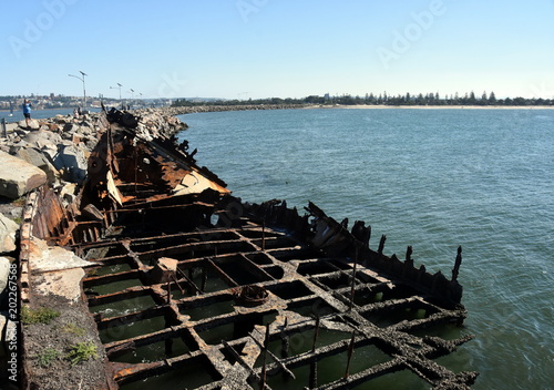 The wreck of the Adolphe on Stockton breakwall (Newcastle, NSW, Australia). The Adolphe was a sailing ship that was wrecked at the mouth of the Hunter River, in 1904.
