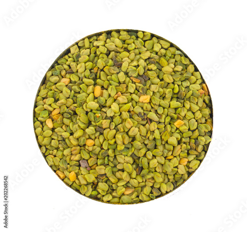 Green Fenugreek Seeds Also Know as Methi Seeds in India isolated on White Background photo