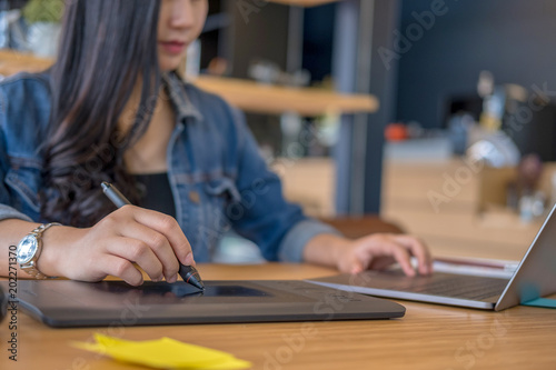 Graphic designers work with computer and mouse pen design products and websites, Graphic designers concept