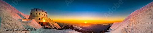Sunset panoramic view of refuge Du Gouter 3835 m  The popular starting point for attempting the ascent of Mont Blanc   France