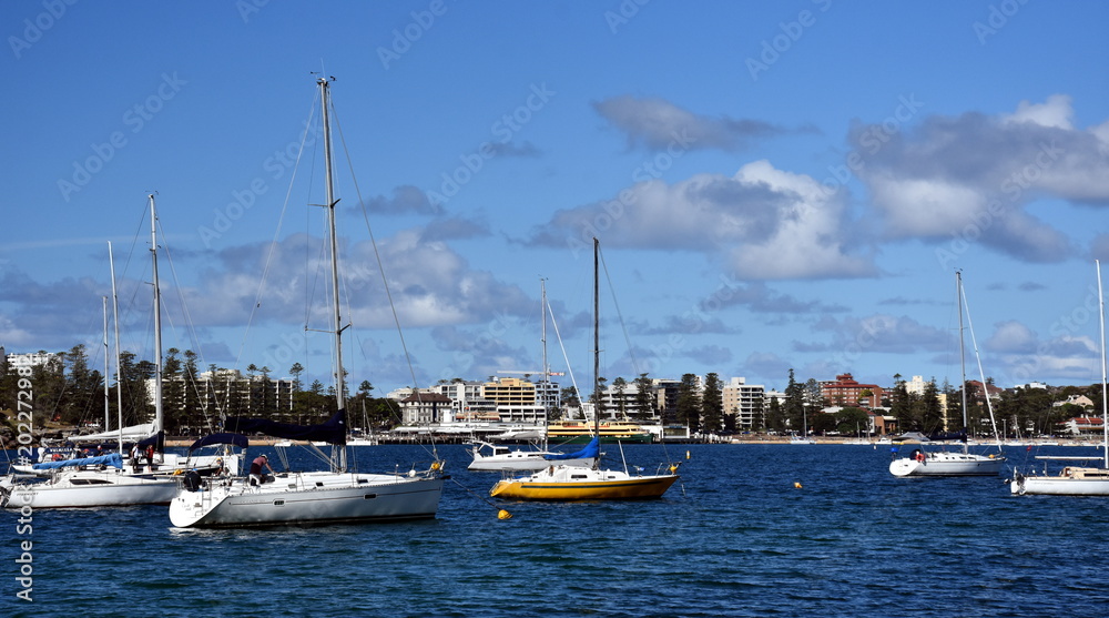 Balgowlah, Australia - Feb 4, 2018. Yachts in North Harbour at Fourty Baskets Beach on a sunny day. Manly in the background. Balgowlah, Australia - Feb 4, 2018. Yachts in North Harbour at Fourty Baskets Beach on a sunny day. Manly in the background.