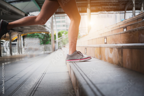 Beautiful scenery of two female joggers pursuing their activity outdoors in the city.