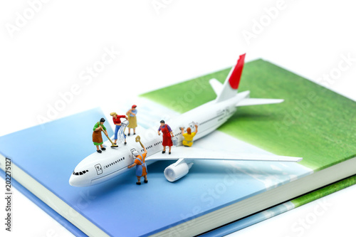 Miniature people : Maid or Housewife cleaning on  air plane using for business trip concept.