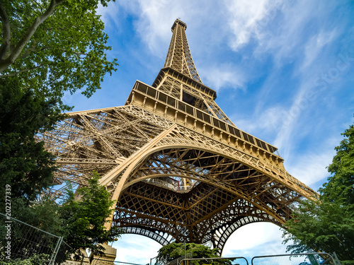 Wide shot of Eiffel Tower with blue sky, Paris, France