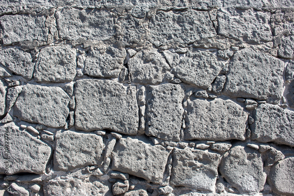 Hintergrund – Natursteinmauer mit eckigen Steinen