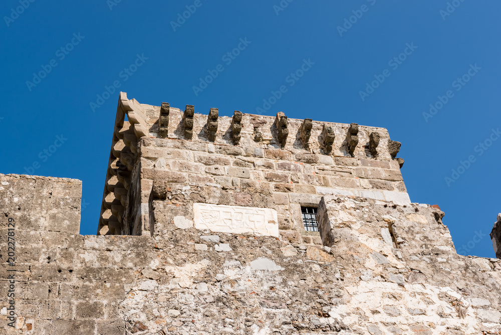 Detailed view of stone tower in Castle of St. Peter or Bodrum Castle, Turkey.