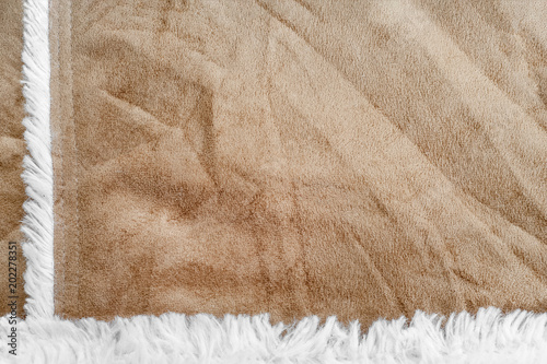 beige suede texture with artificial soft fur. closeup shammy background
