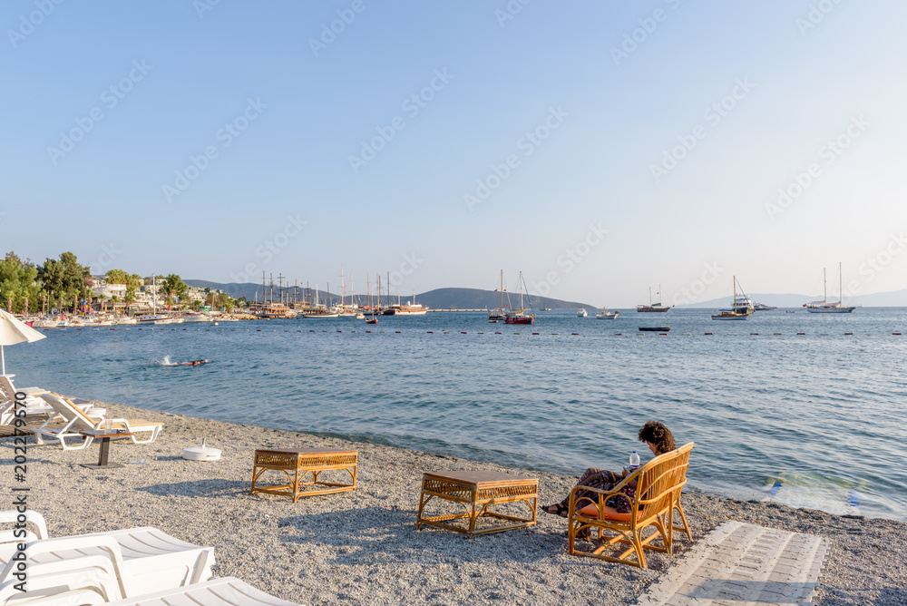 Unidentified people swim and enjoy at beach Unidentified people swim and enjoy at beach