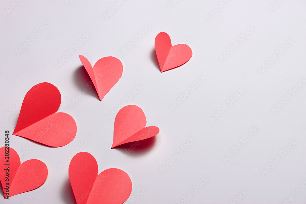 Fold paper Red hearts {Paper Heart cutting}, Heart of paper folding Isolated on White Background. Cards for Valentine's Day There is space for text 
