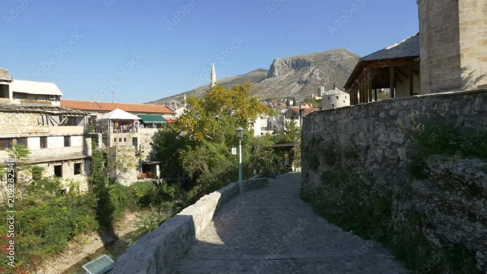 The waterfront of Neretva River in Mostar The waterfront of Neretva River in Mostar