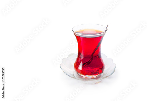 Glass of Turkish tea isolated on white background