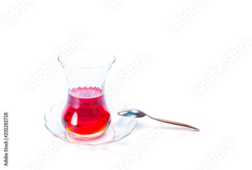 Glass of Turkish tea isolated on white background