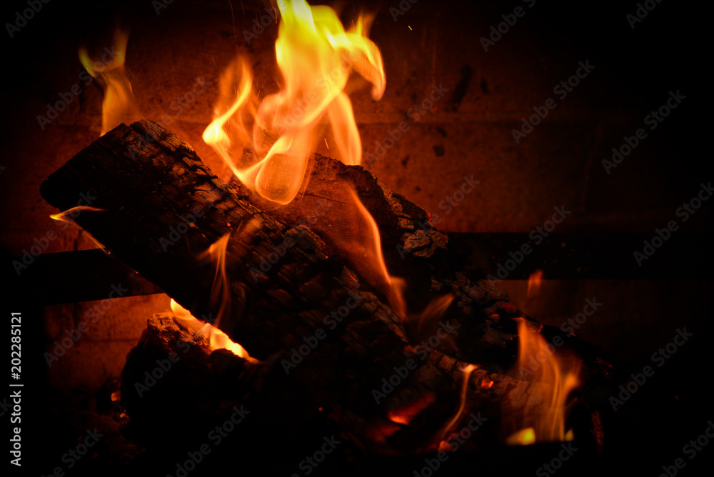 Smoldering ashes of a bonfire. Fire flame in a brick barbecue Smoldering ashes of a bonfire. Fire flame in a brick barbecue
