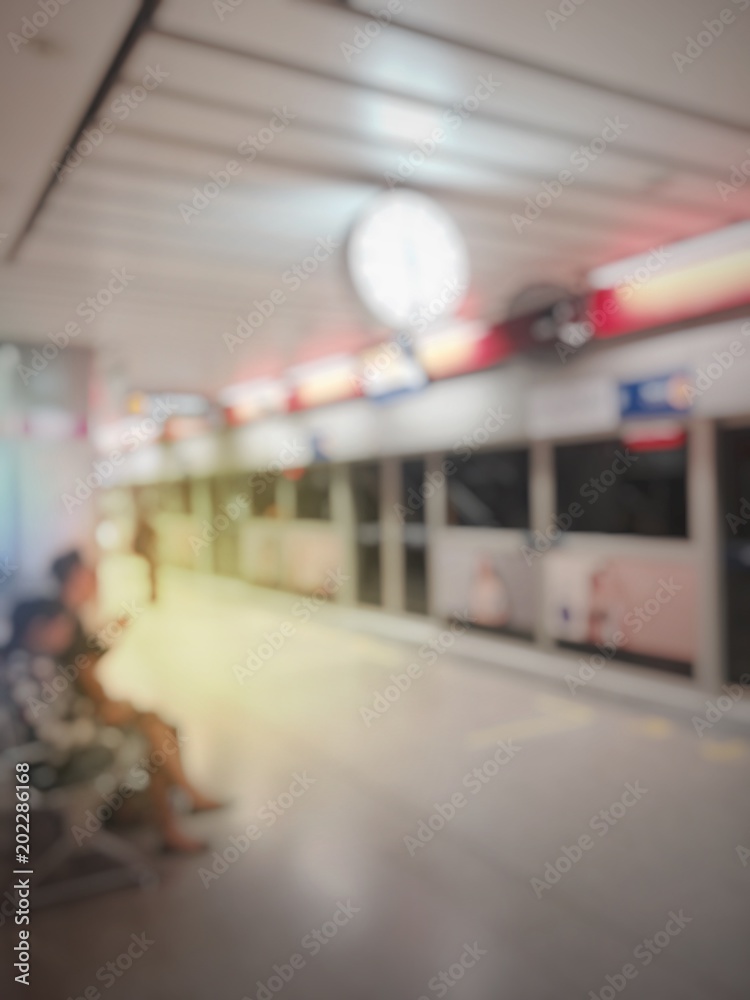 Fototapeta premium blurred image of business people, passenger or city people lifestyle inside the train subway station, transport in rush hour walk at subway station abstract blur, transportation concept.