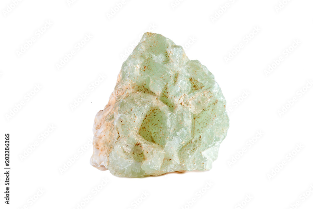 Macro shooting of natural gemstone. The raw mineral is prehnite. Isolated object on a white background. Macro shooting of natural gemstone. The raw mineral is prehnite. Isolated object on a white background.