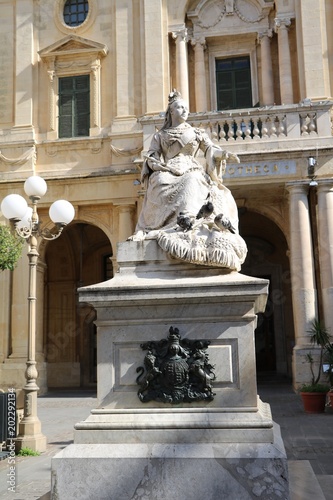 View to Statue of Queen Victoria in front of National Library at Republic Square in Valletta, Malta  photo