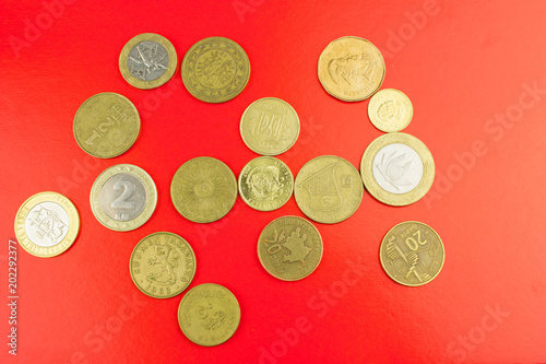 Worlds coins. Money concept. Red texture.