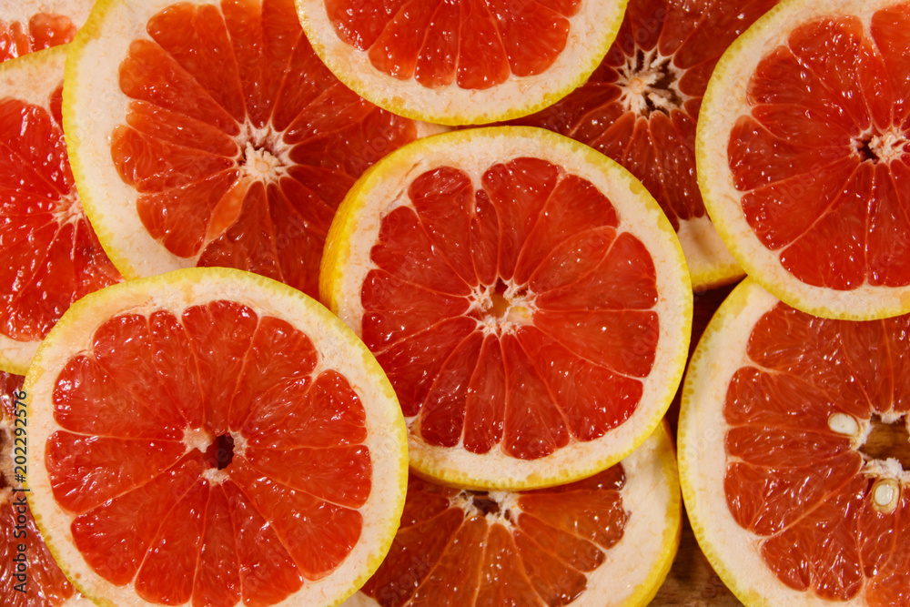 Fresh slices of grapefruits as background Fresh slices of grapefruits as background