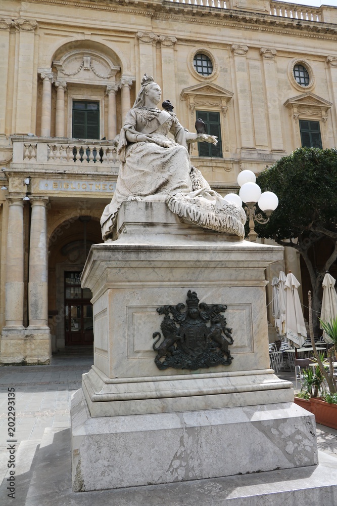 Statue of Queen Victoria in front of the Bibliotheca at Republic Square in Valletta, Malta 