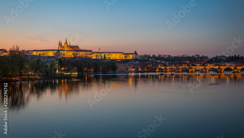 Illuminated Prague Castle and Charles bridge after the sunset, Czech Republic
