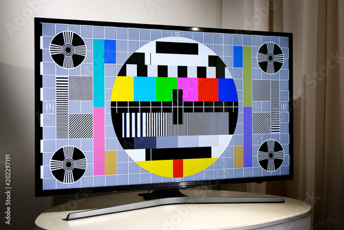 Living room with LCD television displaying multi colored test screen