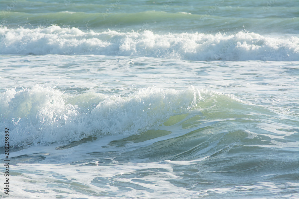 mediterranean sea waves breaking background, green water
