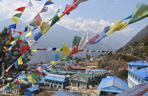 Praying flags above the village of Lukla, Nepal photo